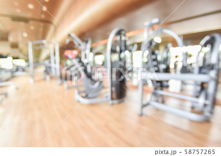Blur gym background fitness center or health club with blurry sports exercise equipment for aerobic workout and bodybuilding Blur gym background fitness center or health club with blurry sports exercise equipment for aerobic workout and bodybuilding 58757265