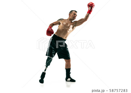 Full length portrait of muscular sportsman with prosthetic leg, copy space. Male boxer in red gloves 58757283