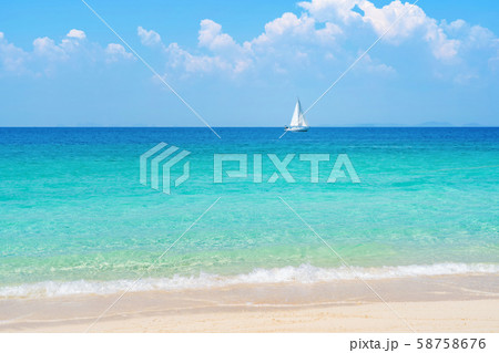 A sailboat in blue turquoise seawater near Phuket A sailboat in blue turquoise seawater near Phuket 58758676