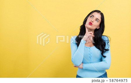 Young woman in a thoughtful pose 58764975