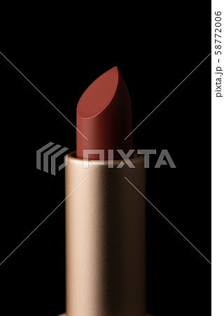 Red lipstick macro close-up isolated on black background. 58772006