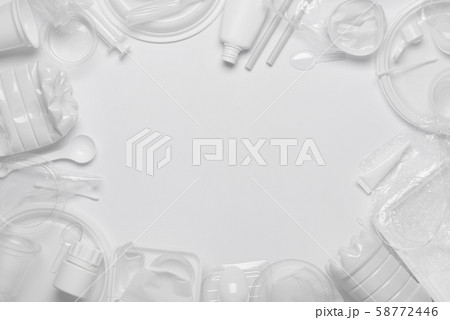 Plastic waste. Single-use plastic objects, ecological pollution. Frame poster background of white packaging plastic products. Top view flat lay. 58772446
