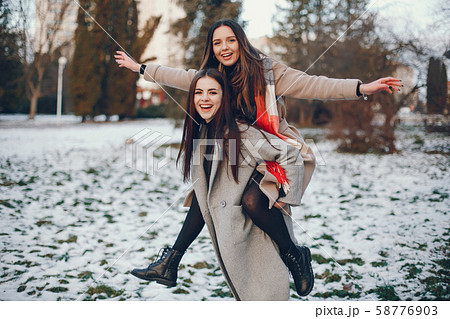 Two stylish girls have a rest in a city 58776903