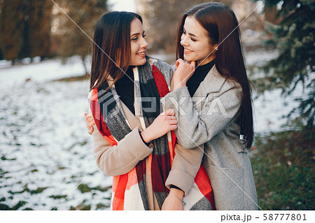 Two stylish girls have a rest in a city Two stylish girls have a rest in a city 58777801
