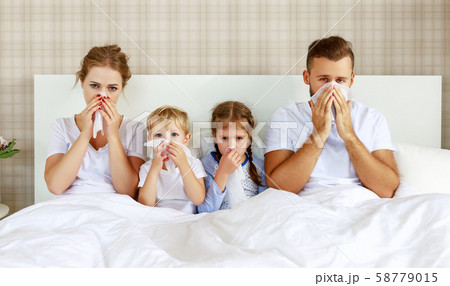 colds and viral diseases. family with runny nose 58779015