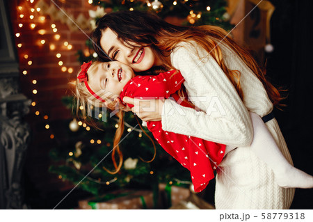 Mother with cute daughter at home Mother with cute daughter at home 58779318