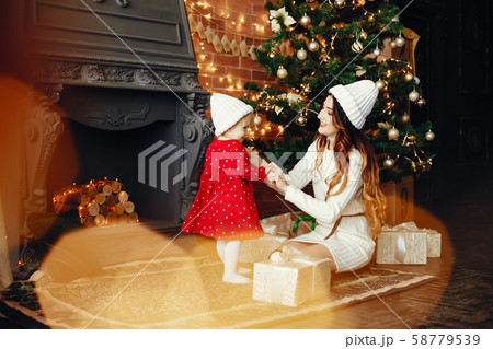 Mother with cute daughter at home Mother with cute daughter at home 58779539