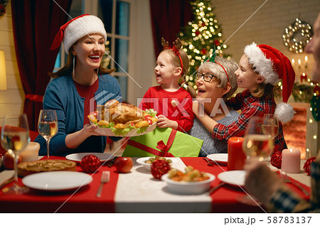 family celebrating Christmas family celebrating Christmas 58783137