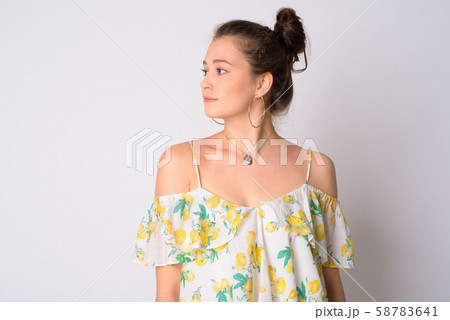 Closeup profile view of young beautiful woman looking over shoulder 58783641