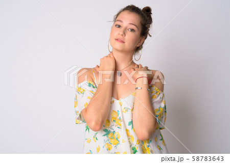 Portrait of young beautiful woman with hair tied posing 58783643