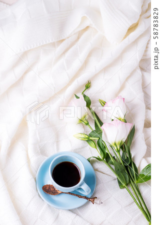 Having a cup of coffee with chocolate, flowers Having a cup of coffee with chocolate, flowers 58783829