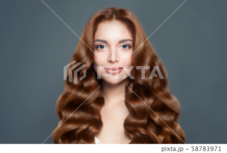 Beautiful woman with long healthy curly hairstyle. Beautiful woman with long healthy curly hairstyle. 58783971