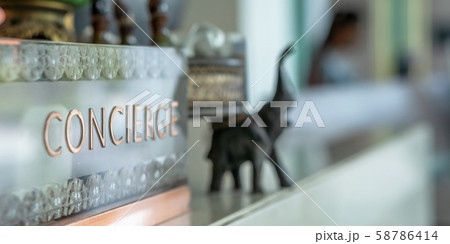 Concierge service counter of hotel, restaurant or apartment's front desk in luxury reception hall in Thailand with staff working for serving tourist guest or check-in customers 58786414
