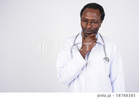 Portrait of serious African man doctor thinking Portrait of serious African man doctor thinking 58788385