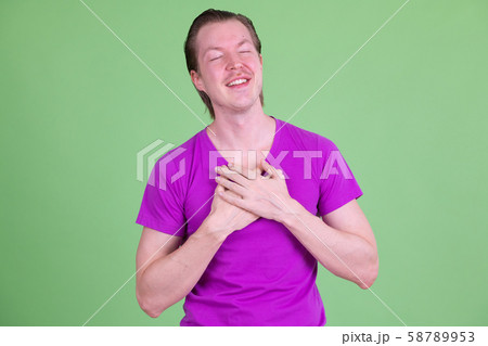 Portrait of happy young handsome man relaxing with eyes closed 58789953