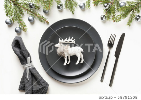 Christmas black table setting with reindeer. Christmas black table setting with reindeer. 58791508