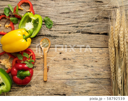 flat lay of blank wooden background space and utensils with herbs , colorful bell pepper and rice plant. top view with copy space. food menu and cooking concept flat lay of blank wooden background space and utensils with herbs , colorful bell pepper and rice plant. top view with copy space. food menu and cooking concept 58792539