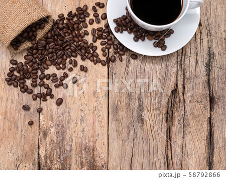 coffee cup and coffee beans on wooden background with copy space, top view. coffee picture background for coffee shop or cafe business. 58792866