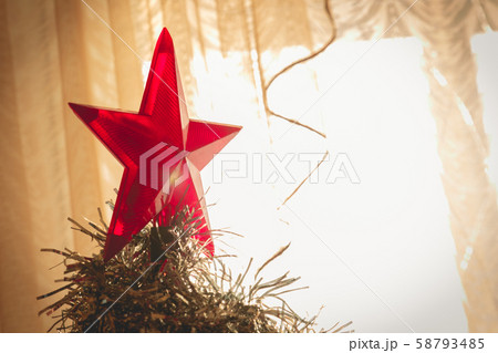 Decorated Christmas tree. Big red star on top of Decorated Christmas tree. Big red star on top of 58793485