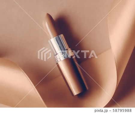 Luxury lipstick and silk ribbon on beige holiday 58795988