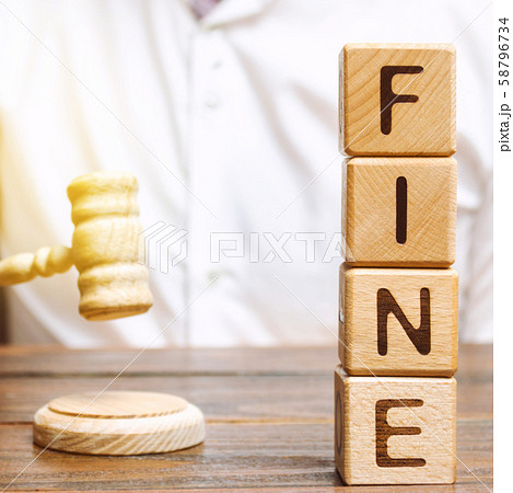 Wooden blocks with the word Fine and judge. 58796734