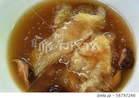 braised fish maw and mushroom in red gravy on bowl braised fish maw and mushroom in red gravy on bowl 58797266