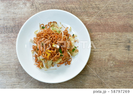 fried instant noodles with tofu and garlic chive on plate 58797269