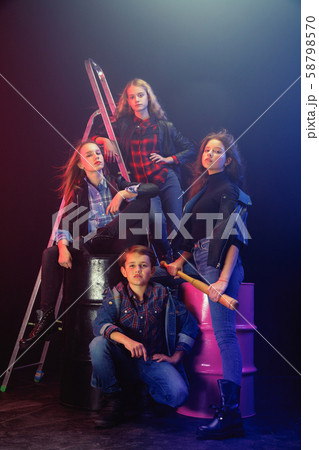 Full length portrait of cute little kids in stylish jeans clothes looking at camera and smiling Full length portrait of cute little kids in stylish jeans clothes looking at camera and smiling 58798570