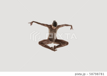 Modern ballet dancer. Contemporary art ballet. Young flexible athletic woman. 58798781