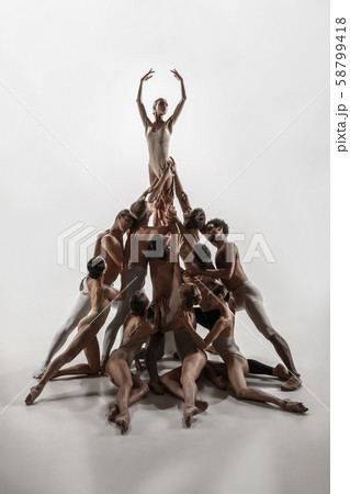 The group of modern ballet dancers. Contemporary art ballet. Young flexible athletic men and women. The group of modern ballet dancers. Contemporary art ballet. Young flexible athletic men and women. 58799418