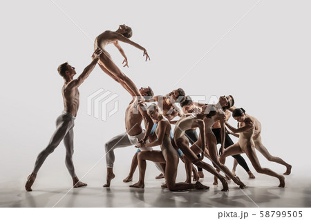 The group of modern ballet dancers. Contemporary art ballet. Young flexible athletic men and women. The group of modern ballet dancers. Contemporary art ballet. Young flexible athletic men and women. 58799505