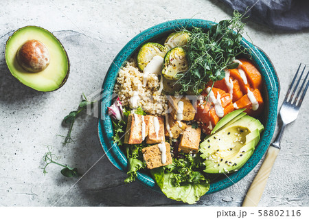 Buddha bowl with quinoa, tofu, avocado 58802116