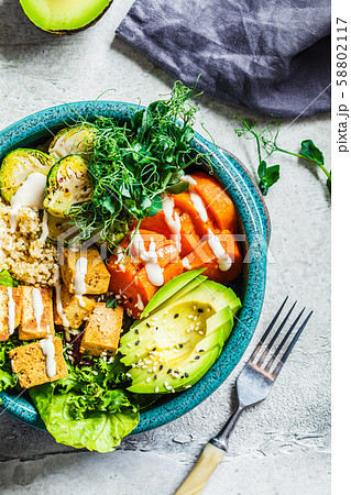 Buddha bowl with quinoa, tofu, avocado 58802117