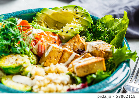 Buddha bowl with quinoa, tofu, avocado 58802119