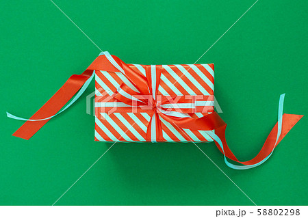 Background with red and white striped gift box Background with red and white striped gift box 58802298