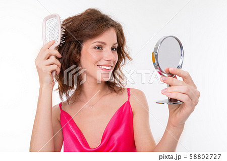 Young beautiful girl with wavy brown hair, clean skin, flat teeth, beautiful smile, in pink jersey Young beautiful girl with wavy brown hair, clean skin, flat teeth, beautiful smile, in pink jersey 58802727