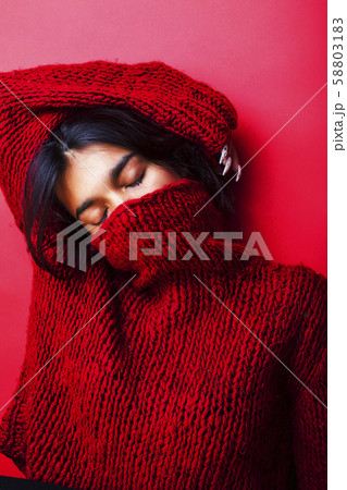 young pretty indian girl in red sweater posing emotional, fashion hipster teenage, lifestyle people young pretty indian girl in red sweater posing emotional, fashion hipster teenage, lifestyle people 58803183