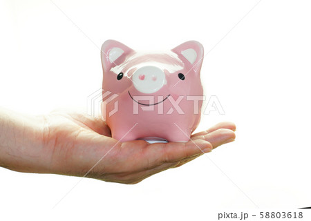 Hand carry pink piggy save money isolated on white 58803618