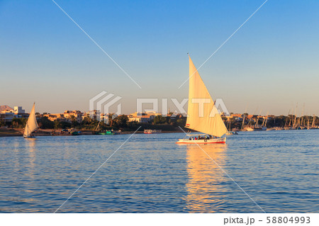 Felucca boats sailing on the Nile river in Luxor Felucca boats sailing on the Nile river in Luxor 58804993