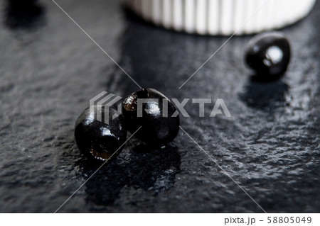 Black olives on black stone 58805049