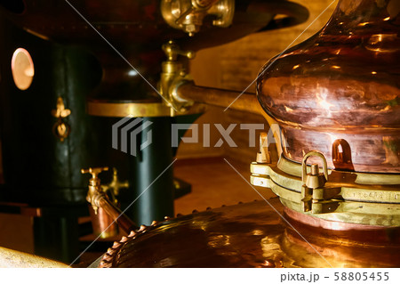 Detalis of medieval traditional distiller cube made from copper production of alcohol, cognac 58805455