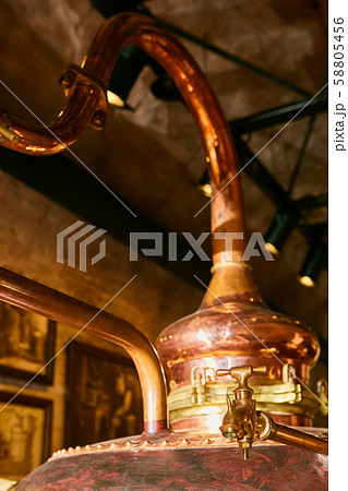 Detalis of medieval traditional distiller cube made from copper production of alcohol, cognac Detalis of medieval traditional distiller cube made from copper production of alcohol, cognac 58805456