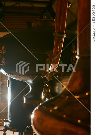 Detalis of medieval traditional distiller cube made from copper production of alcohol, cognac Detalis of medieval traditional distiller cube made from copper production of alcohol, cognac 58805458