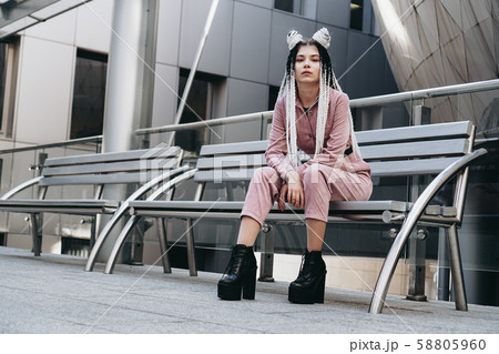 Young woman with futuristic looks. Girl with black and white pigtails Young woman with futuristic looks. Girl with black and white pigtails 58805960