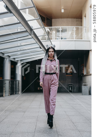 Beautiful cool girl with dreadlocks full length. Photo in the city Beautiful cool girl with dreadlocks full length. Photo in the city 58805979