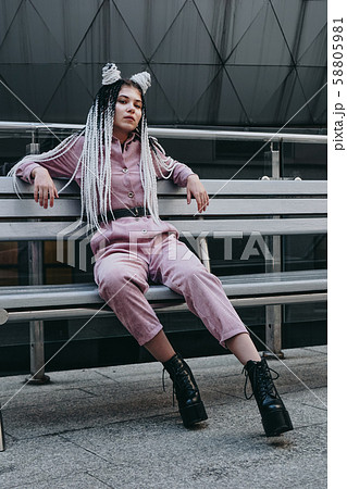 Young woman with futuristic looks. Girl with black and white pigtails Young woman with futuristic looks. Girl with black and white pigtails 58805981