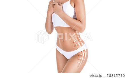 Female tanned body with lines and arrows over white background. Fat removing concept. 58815750