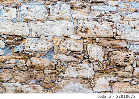 Close up old partially destroyed stonewall texture Close up old partially destroyed stonewall texture 58818678
