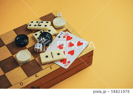 Various board games chess board, playing cards, 58821976