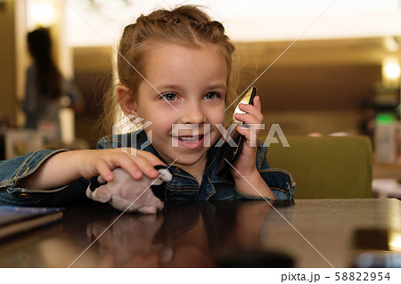 Little girl in a cafe 58822954